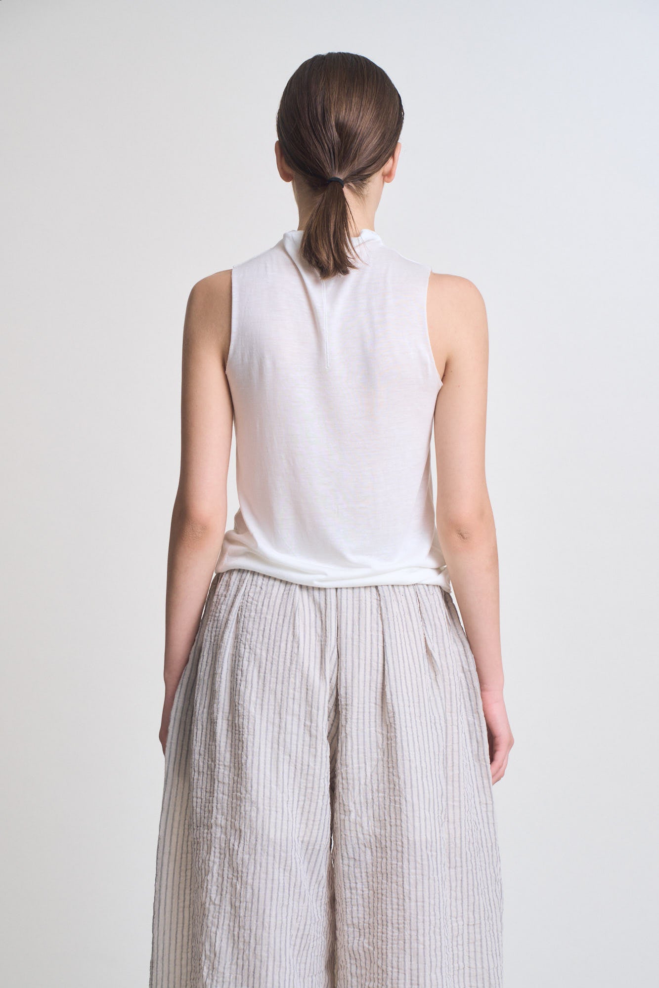 Cut And Sew Sleeveless Mock Neck Top in Off White