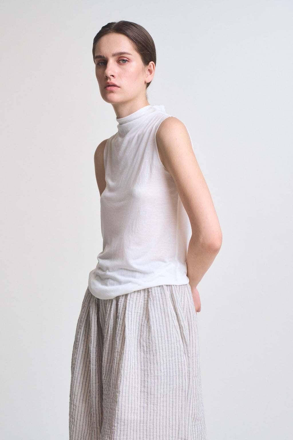 Cut And Sew Sleeveless Mock Neck Top in Off White