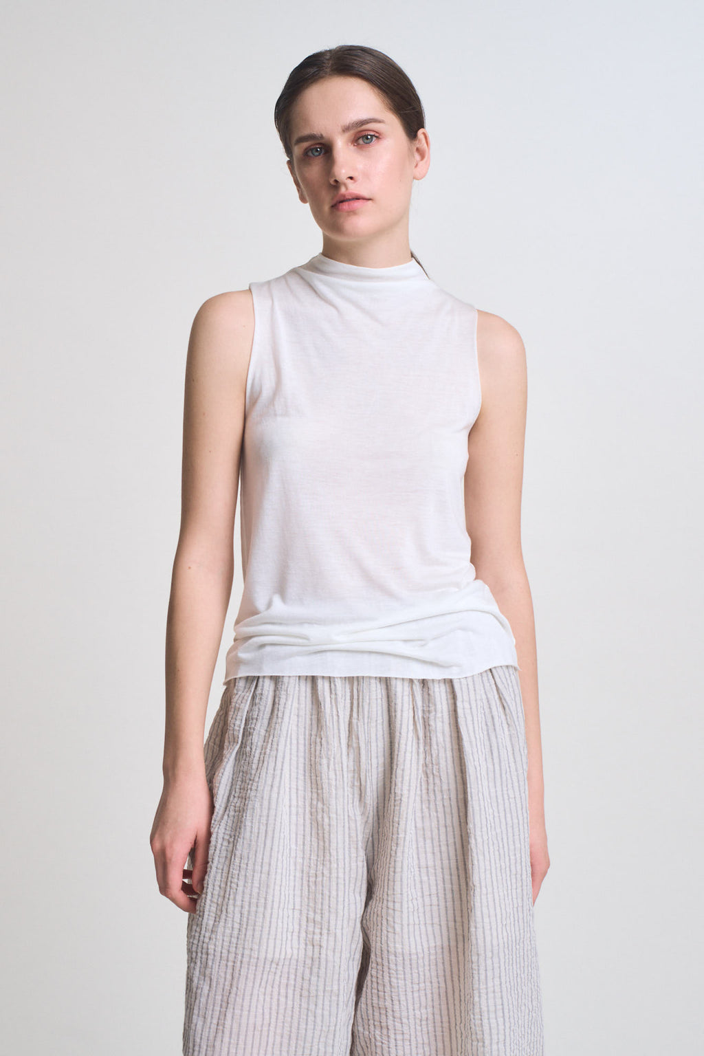 Cut And Sew Sleeveless Mock Neck Top in Off White