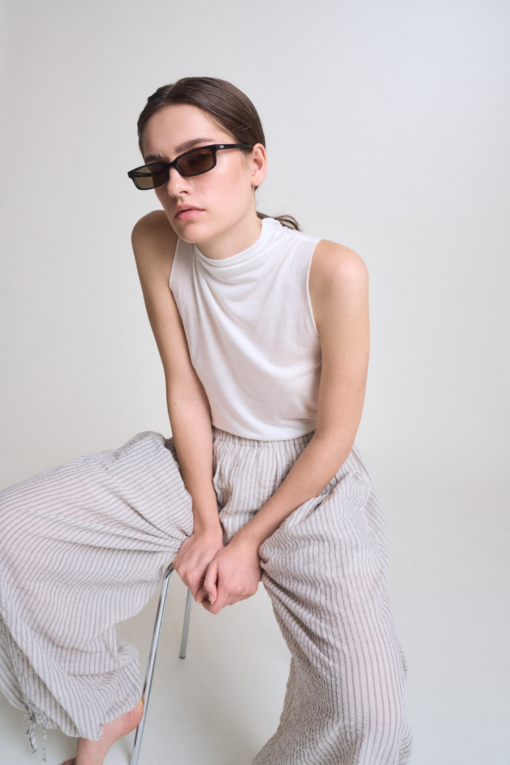 Cut And Sew Sleeveless Mock Neck Top in Off White