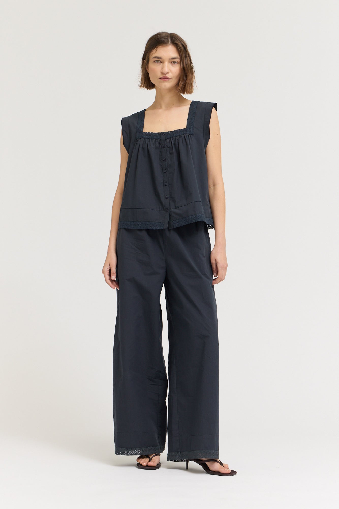 Eyelet Trim Detailed Sleeveless Top in Atlantic