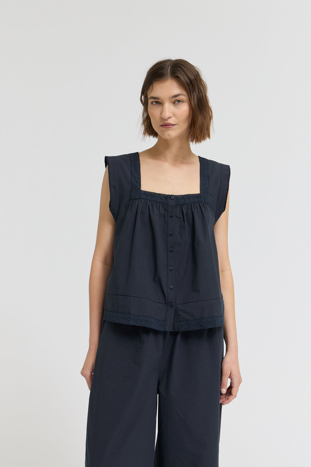 Eyelet Trim Detailed Sleeveless Top in Atlantic